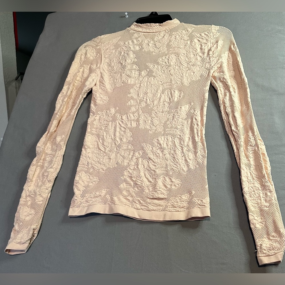 Beautiful Light pink see through mesh with flower designs very stretchy has tags